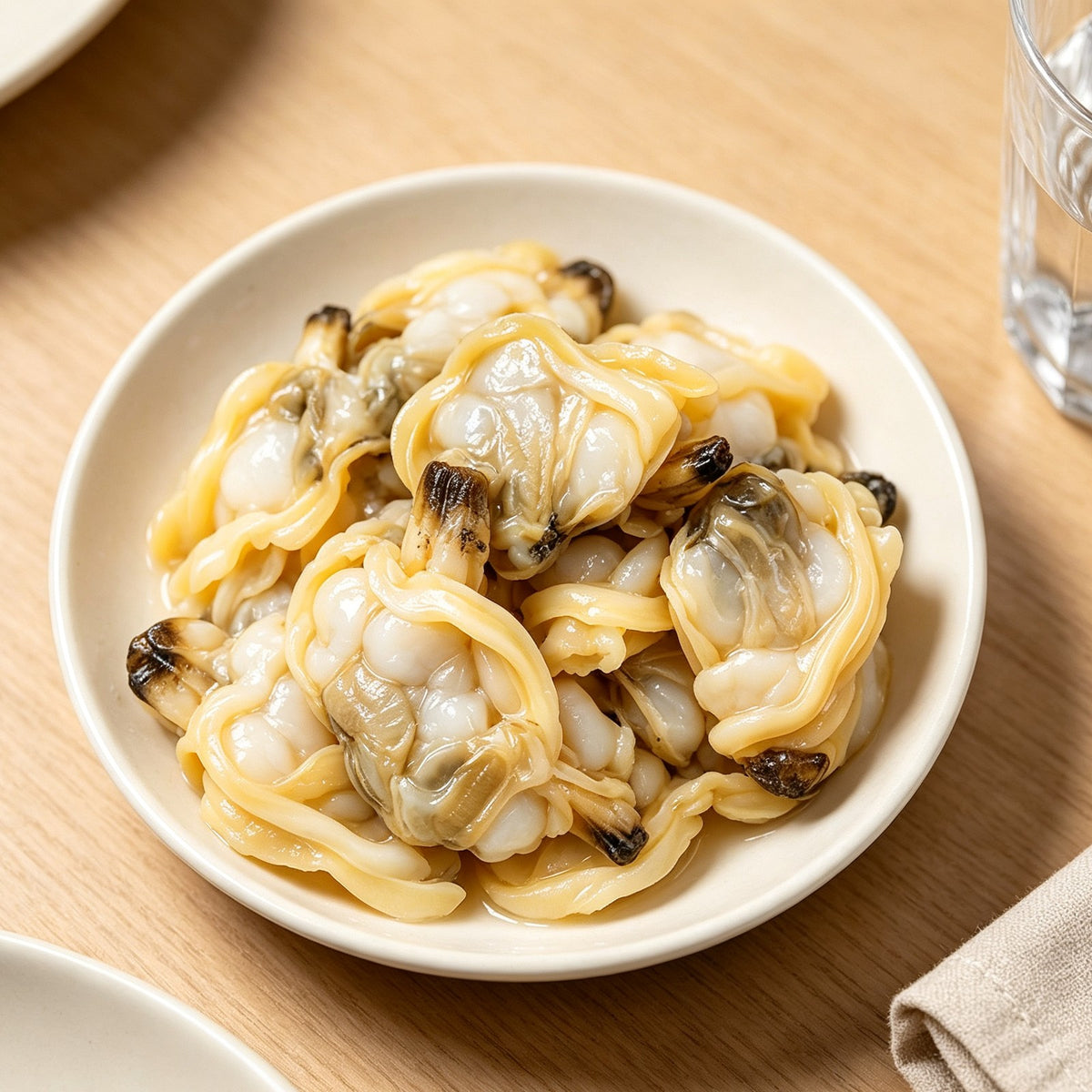 Shucked clam meat in a bowl